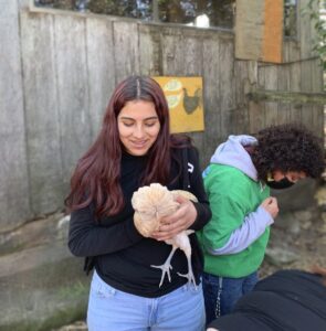 Lili holding a chicken